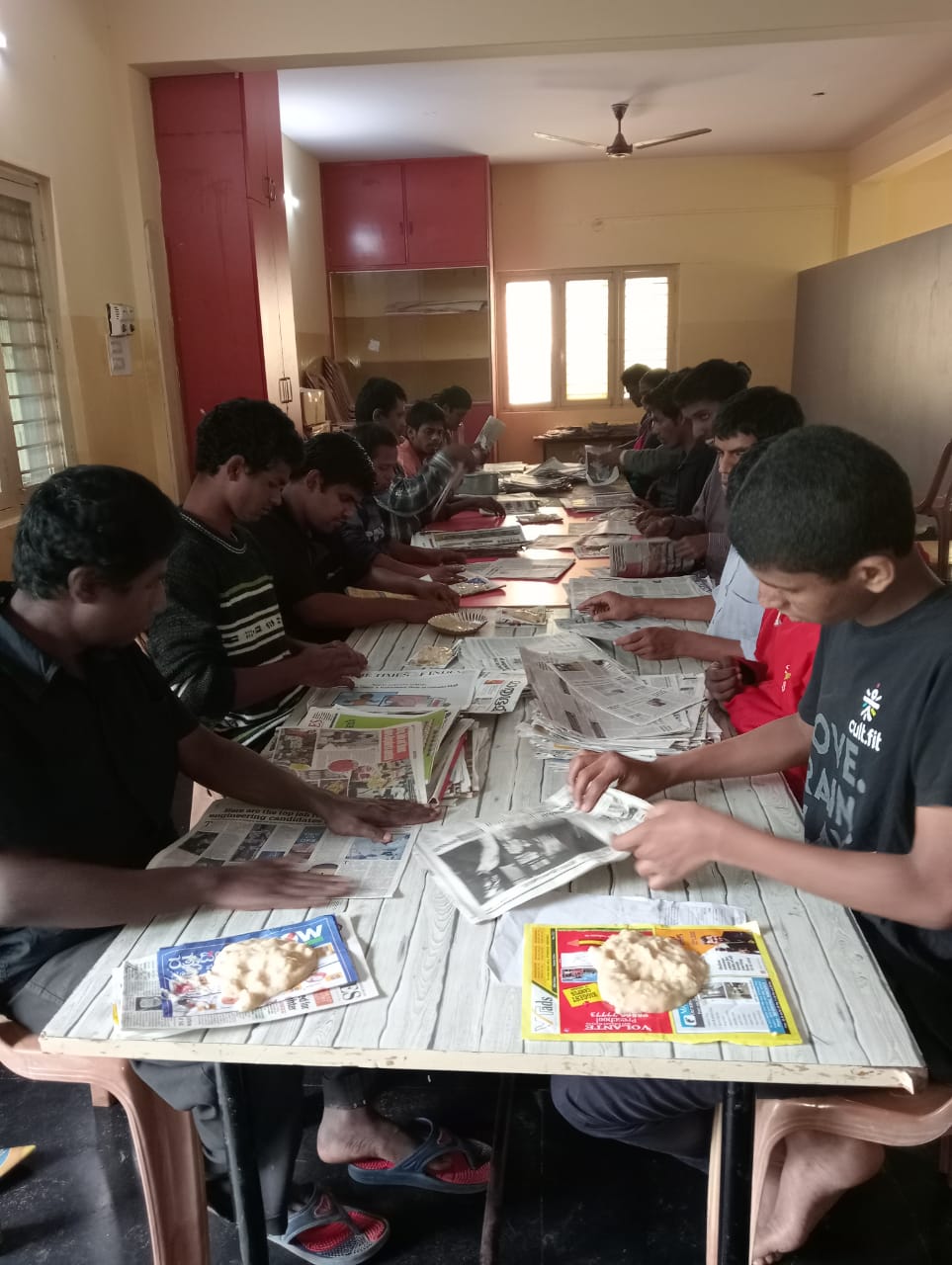 Differently-abled boys making bags