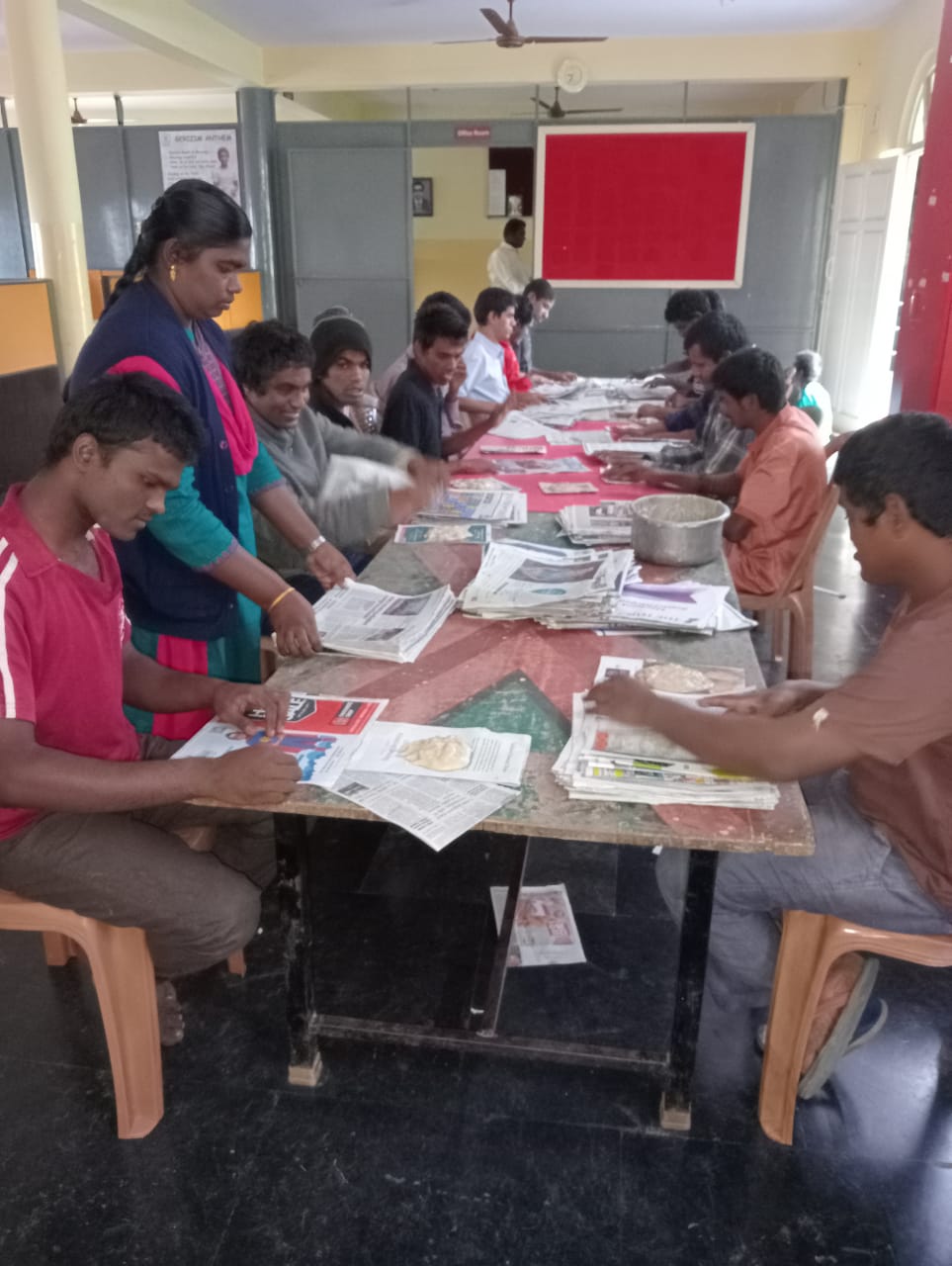 Differently-abled boys making bags