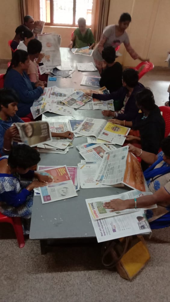 Differently-abled girls making bags