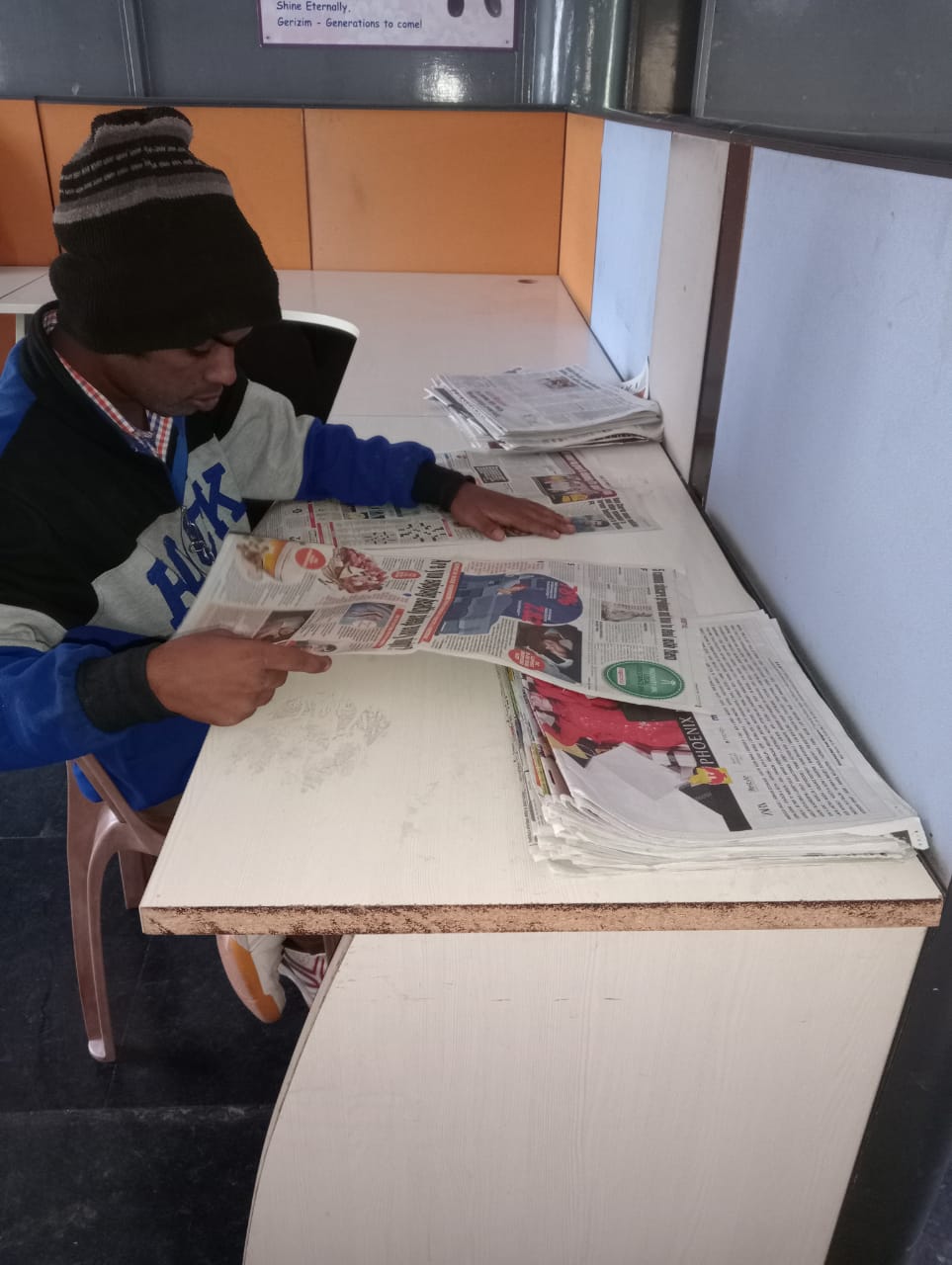 Older child sorting newspapers